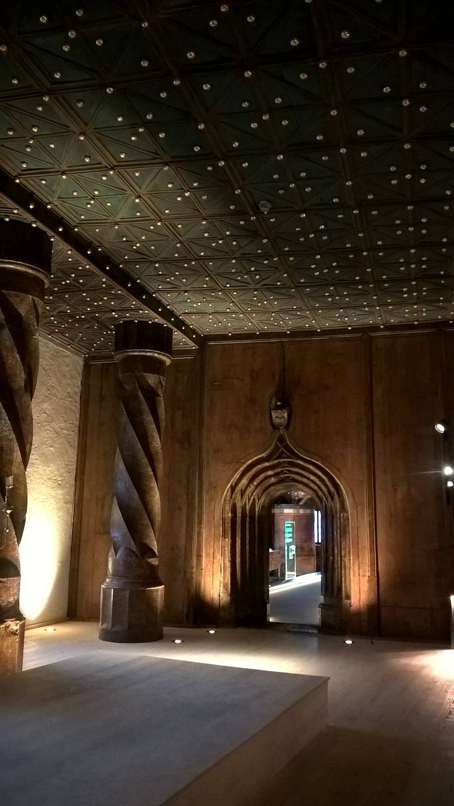 An ornate vaulted ceiling and stone columns in the Princely Rooms, Salzburg Fortress.